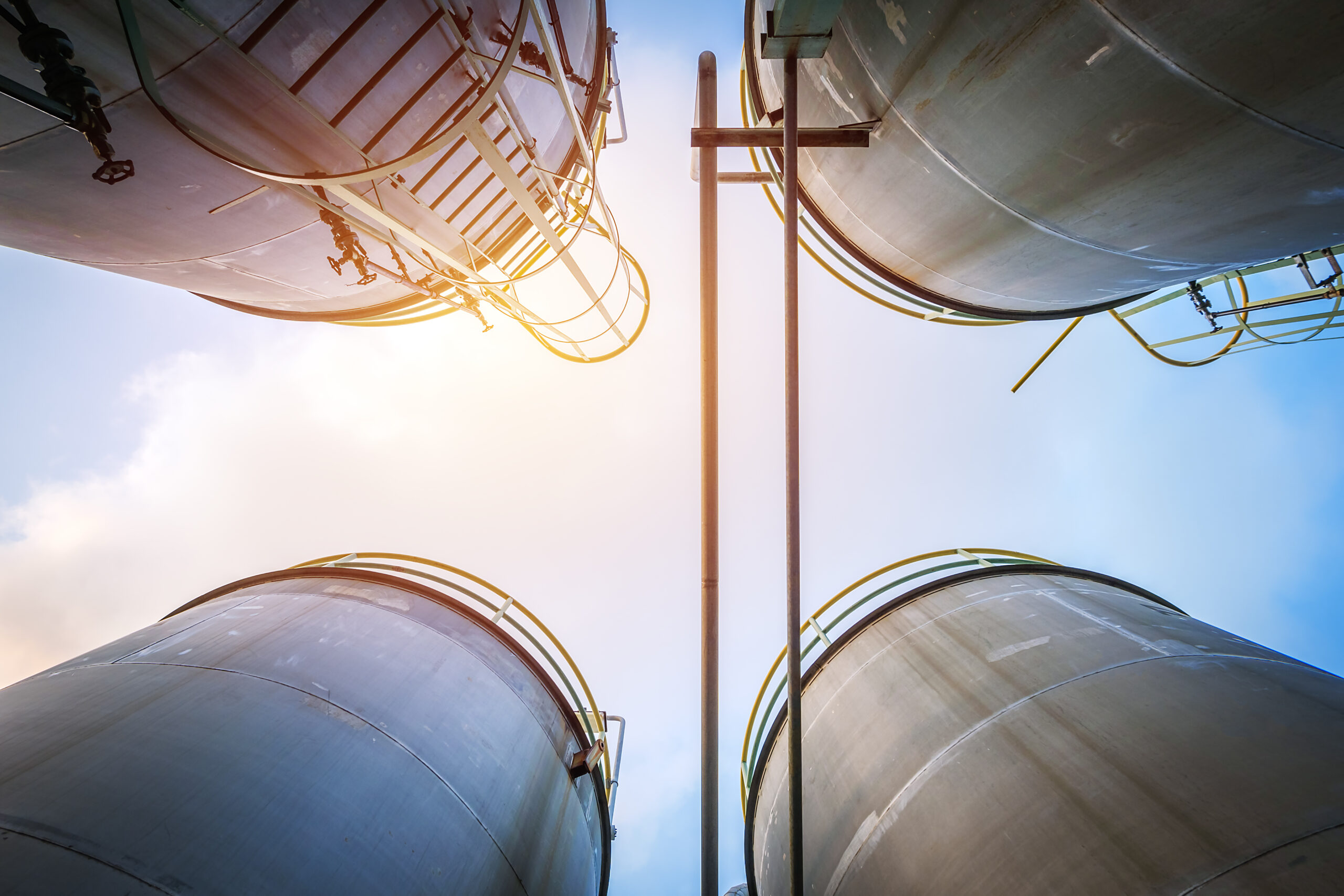 Stainless tanks and pipeline for liquid chemical industrial on sky background