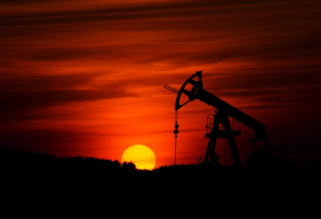 An oil rig at sunset