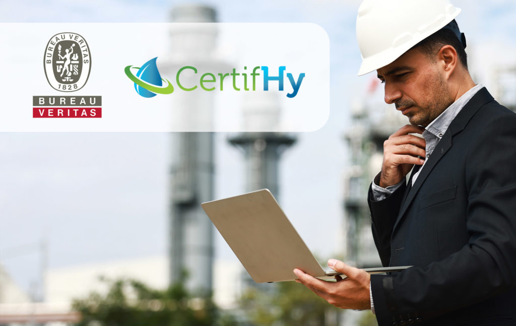 Smart business man concentrate working on laptop at site line of Cogeneration power plant , Engineering and business investment concept