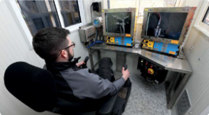 Man using joysticks in techical simulation