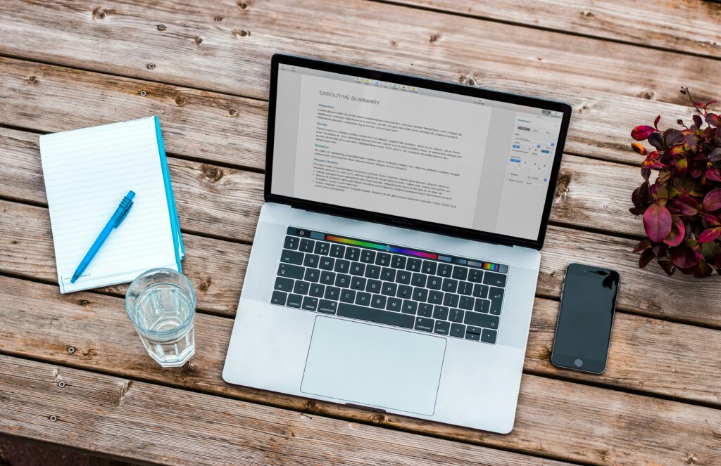 A laptop and a phone on a table