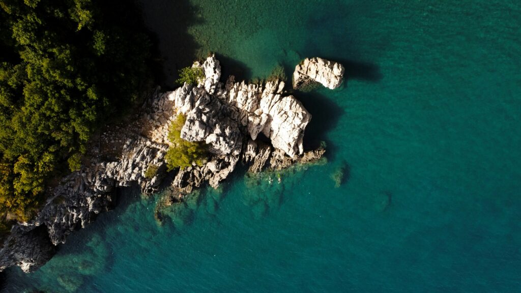 A rocky island surrounded by water