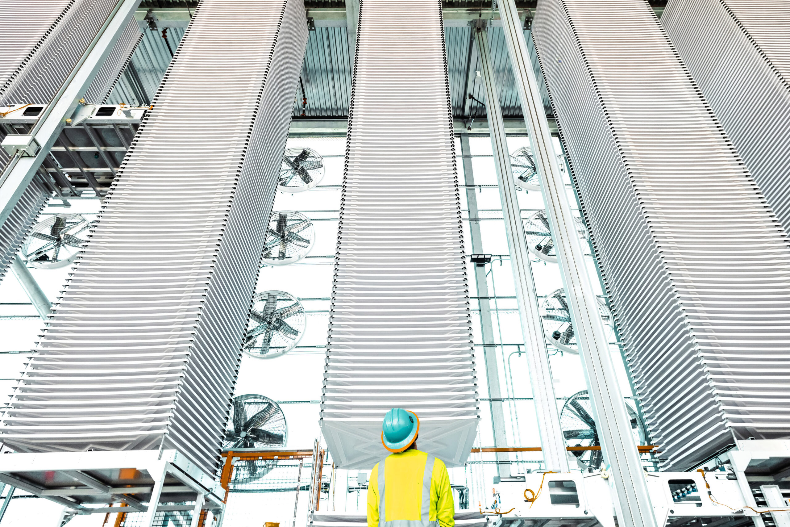 a person wearing a hard hat and yellow vest