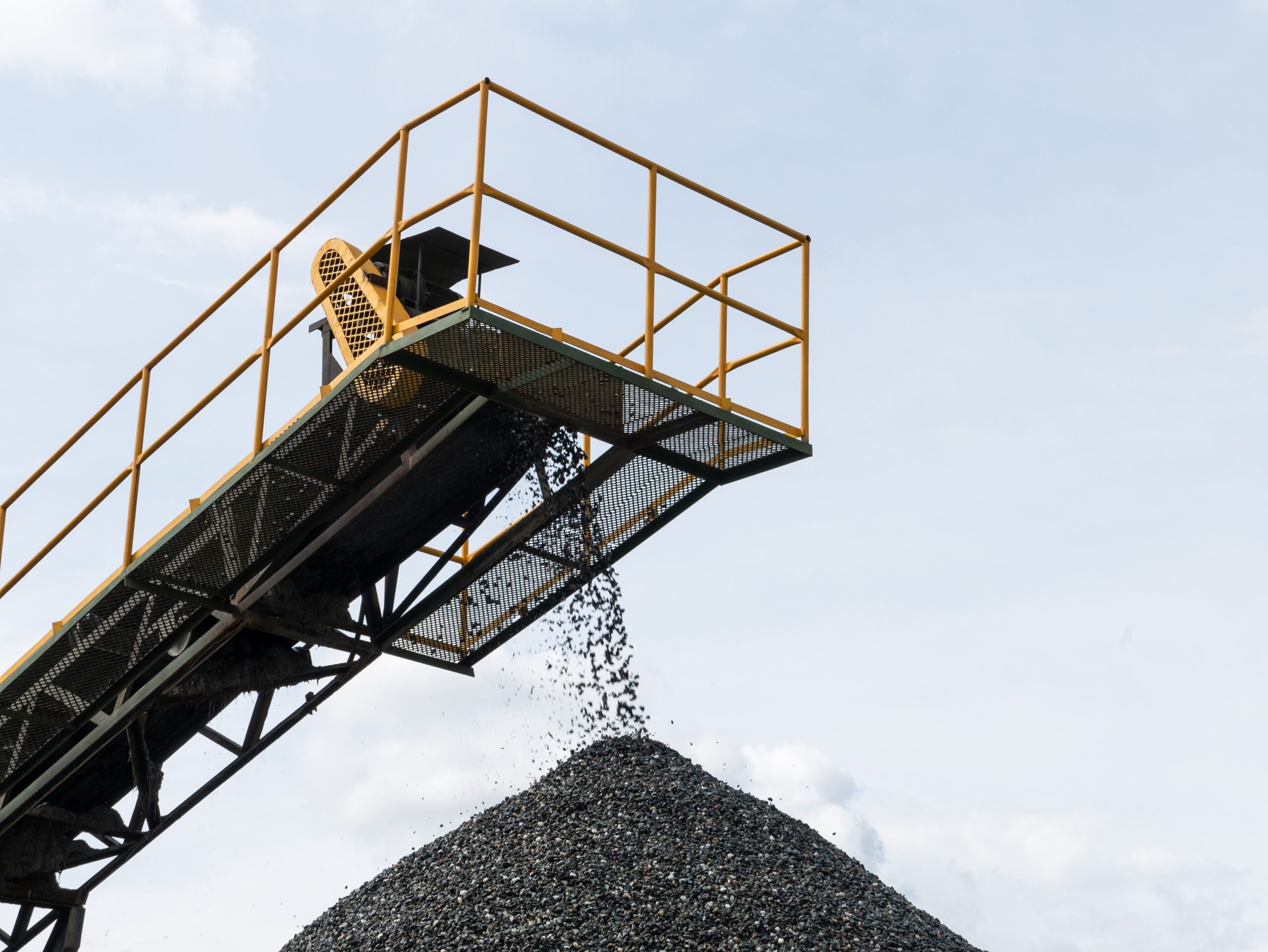 Coal pile, with coal coming from a machine