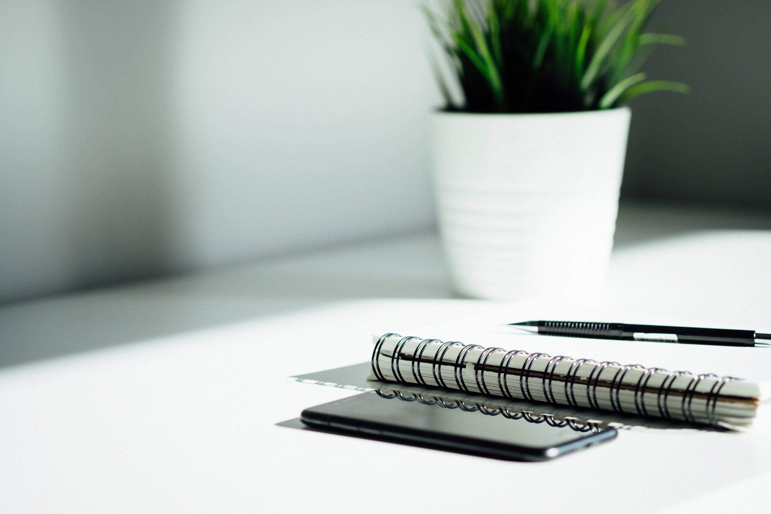 A notebook and pen on a table