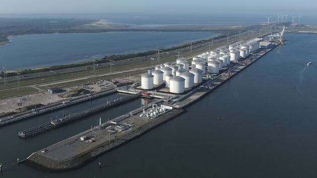 a large white tanks on a dock